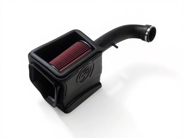 S&B enclosed cold air intake system for a pickup truck, featuring a high-flow pleated air filter, sealed air box, and molded intake tube designed to increase airflow and improve engine performance.