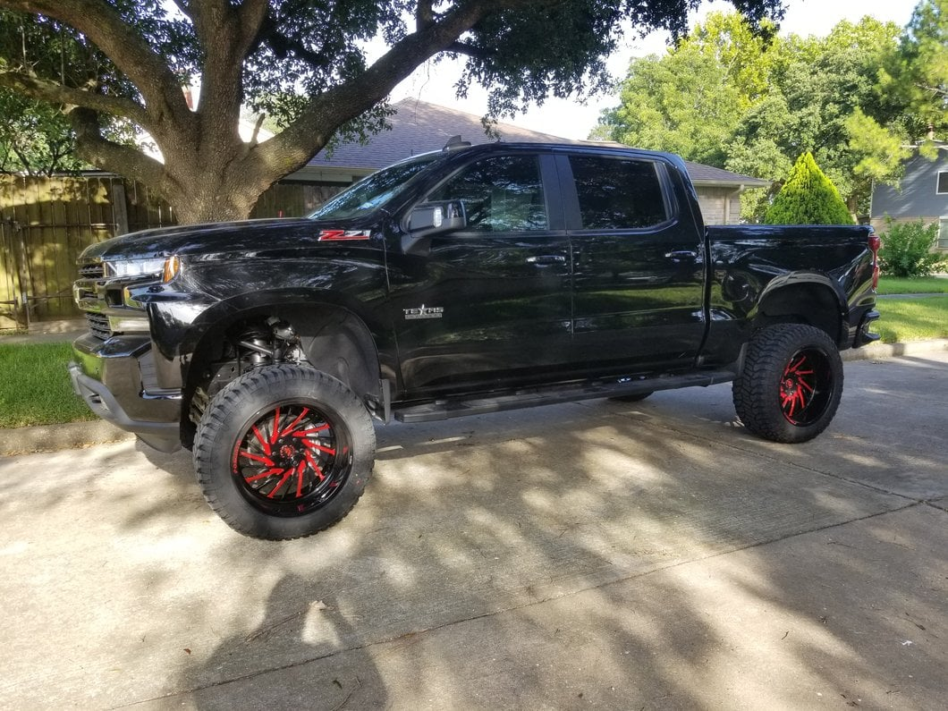 Lifted Black Silverado Pickup Truck