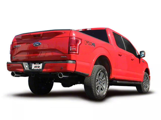 Red Ford F-150 with a dual-exit performance exhaust system, featuring polished exhaust tips exiting beneath the rear bumper.