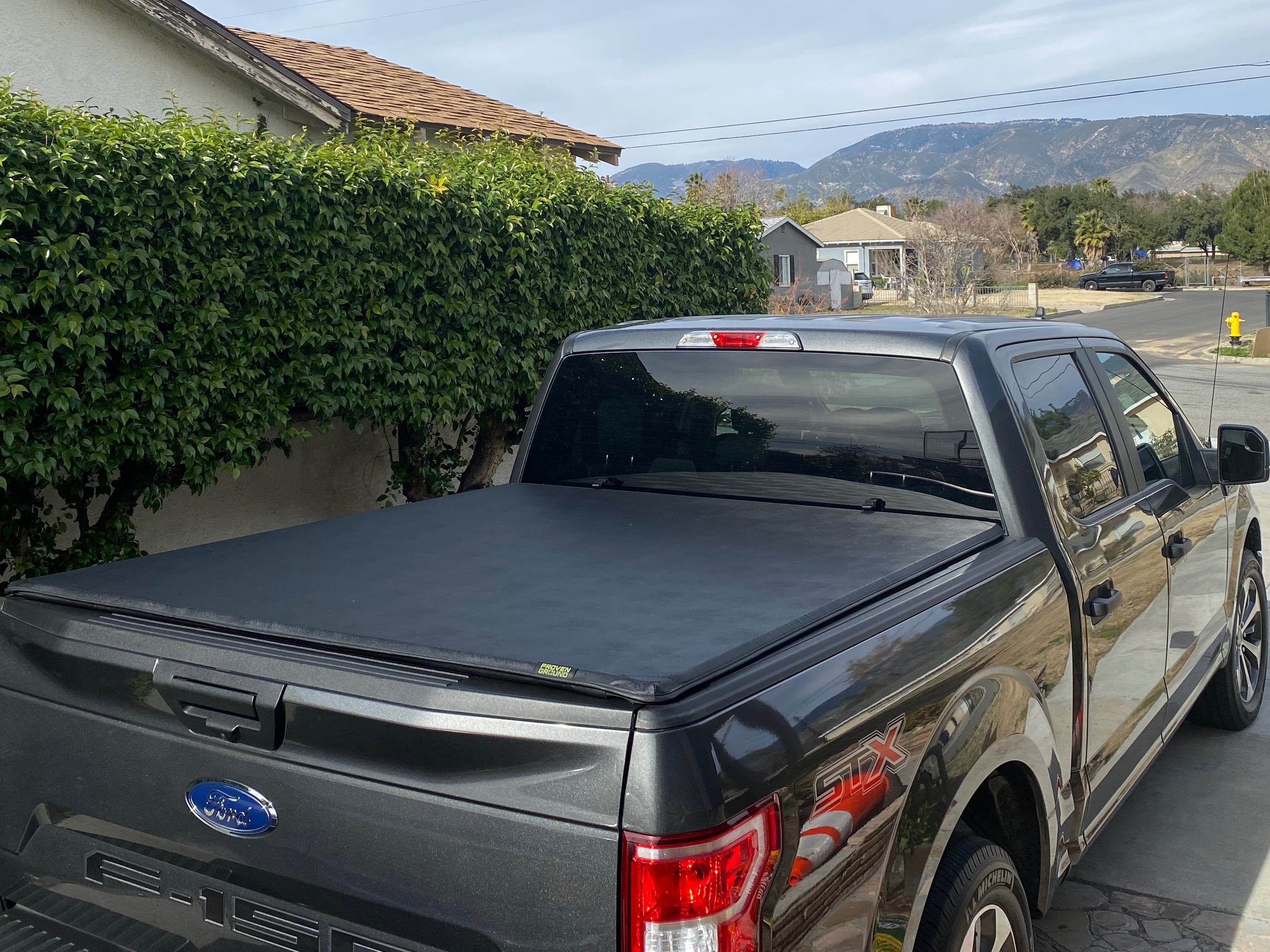 Tonneau cover installed on a truck providing weather protection for cargo in the bed
