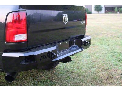 Fab Fours Premium Rear Bumper; Not Pre-Drilled for Backup Sensors; Bare Steel (09-18 RAM 1500 w/ Factory Dual Exhaust)