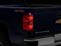OEM Style Tail Light; Black Housing; Red/Clear Lens; Driver Side (14-18 Silverado 1500 w/ Factory Halogen Tail Lights)