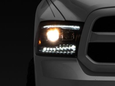 Raxiom LED Projector Headlights with Switchback Turn Signals; Black Housing; Clear Lens (09-18 RAM 1500 w/ Factory Halogen Non-Projector Headlights)