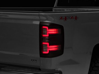 Raxiom LED Tail Lights with Sequential Turn Signals; Black Housing; Clear Lens (14-18 Silverado 1500 w/ Factory Halogen Tail Lights)