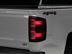 Raxiom LED Tail Lights with Sequential Turn Signals; Black Housing; Clear Lens (14-18 Silverado 1500 w/ Factory Halogen Tail Lights)